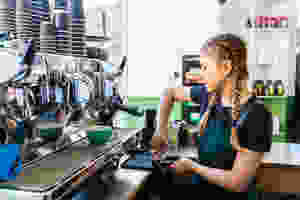 A young woman working at a coffee shop