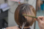 Woman getting her hair cut