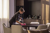 Woman Cleaning Office Desk