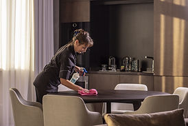 Housekeeper Wiping the Table