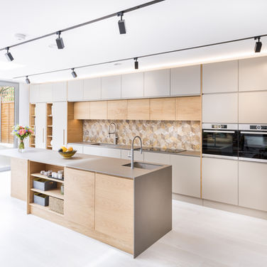 Sacramento kitchen remodel with navy and white two-tone cabinets and brass fixtures by GBG Construction Inc.