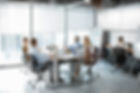 Team Working in Glass Partitioned Office