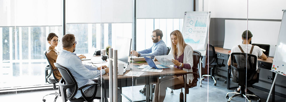 Team Working in Glass Partitioned Office
