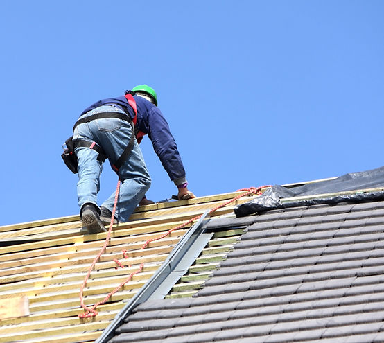 roofer on the top of a roof