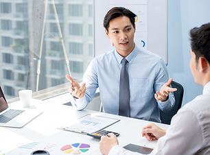 A man talking with a colleague