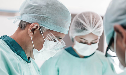 Surgeons During Operation Surgical injuries can lead to medical malpractice