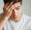 Man holding head