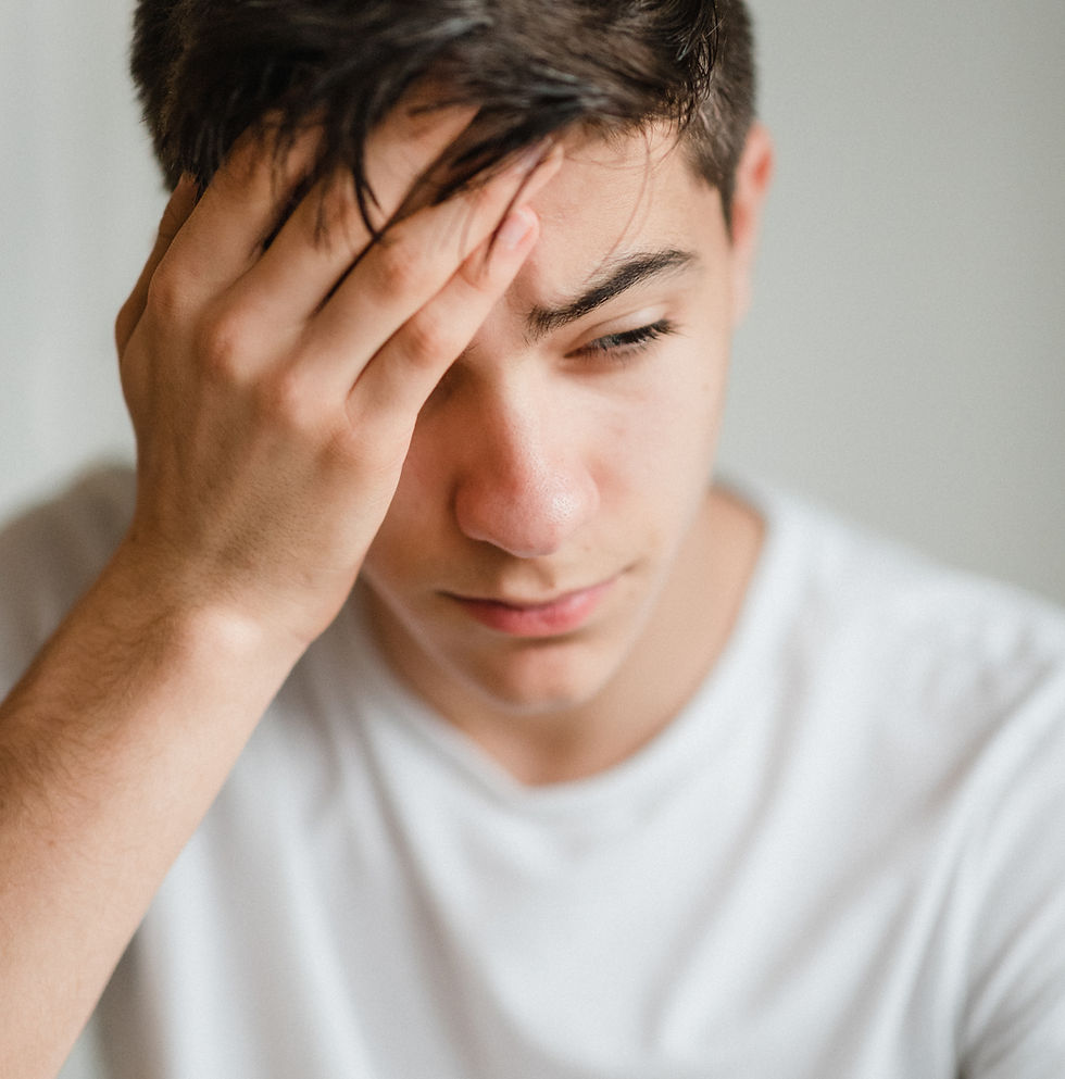 Neurology and Headache Practice: Young man touches his head because he has a migraine