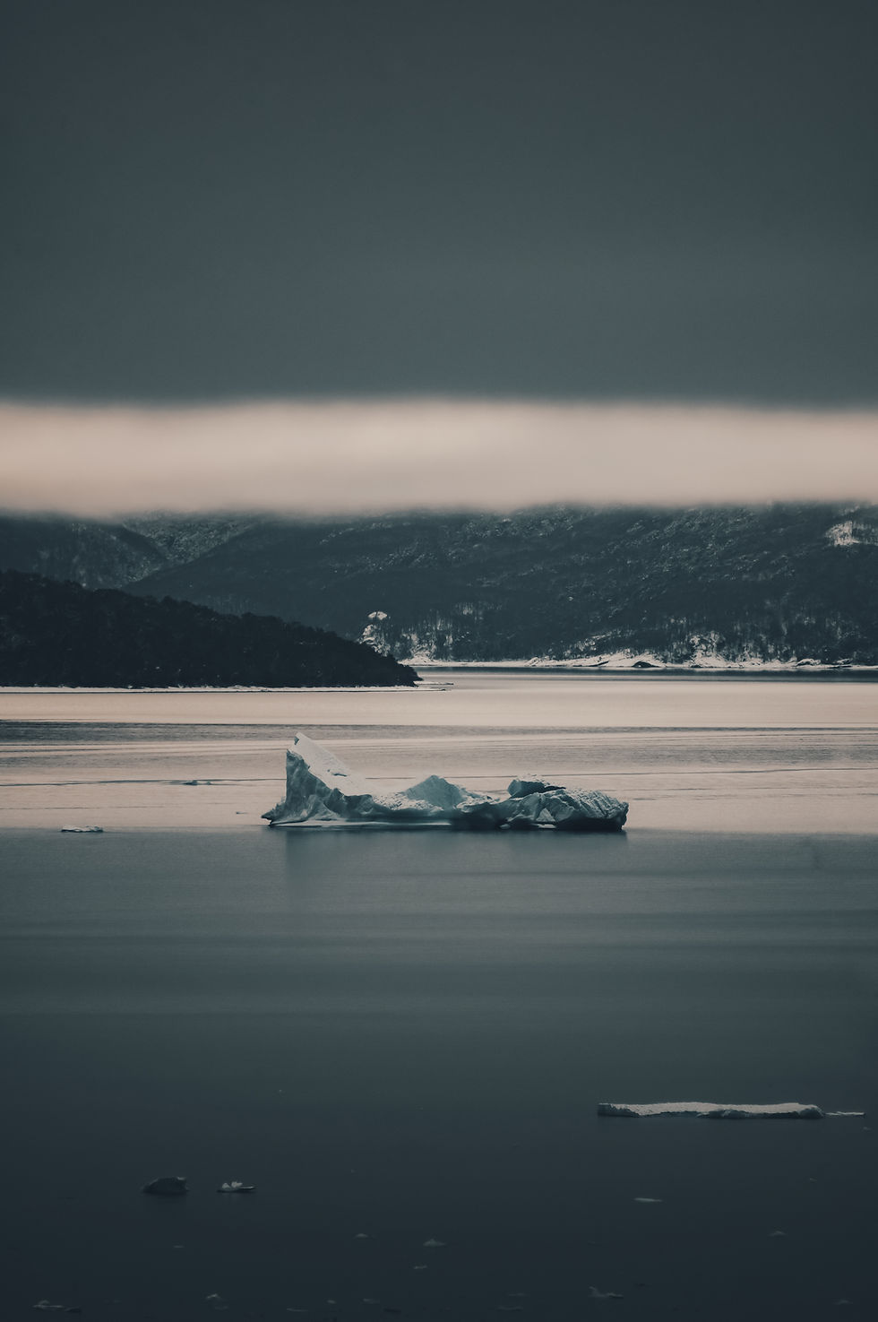 Iceberg In Frozen Landscape