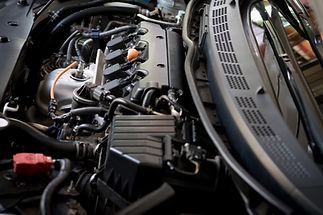 Close-up of a car engine, detailing complex components and wiring