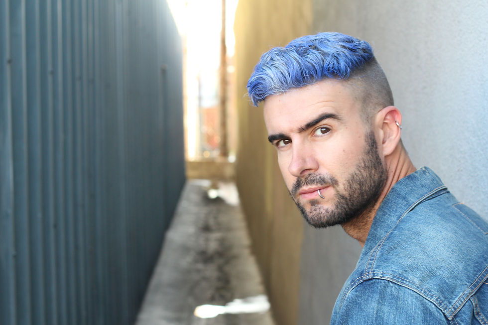 A Person with blue hair and denim jacket