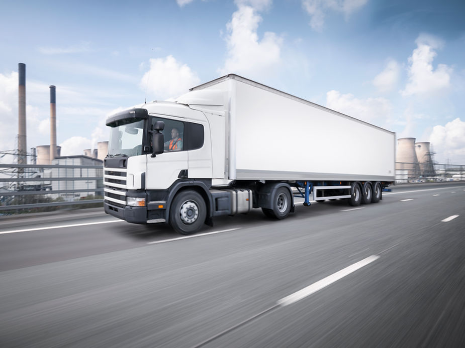 a white truck on highway