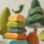 Toy bird on stacked colorful wooden blocks, with abstract tree shapes in the background. Calm and playful atmosphere.
