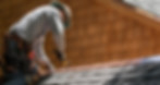A Roofer Fixing Shingles Roof