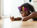 Girl lying on floor, on phone 