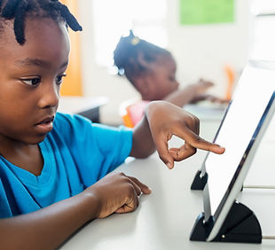 Child using AAC device or tablet