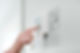 A woman setting an alarm