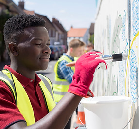 Man Painting a Wall