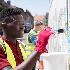 Man Painting a Wall