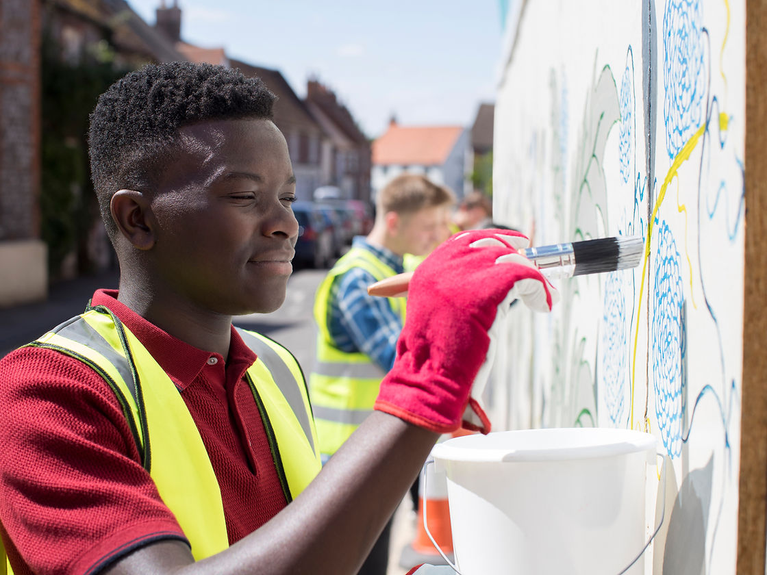 Man Painting a Wall