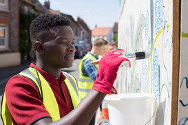Man Painting a Wall