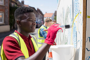 Man Painting a Wall