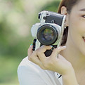 Photographer with Retro Camera