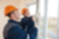 Two workers installing double-glazed windows