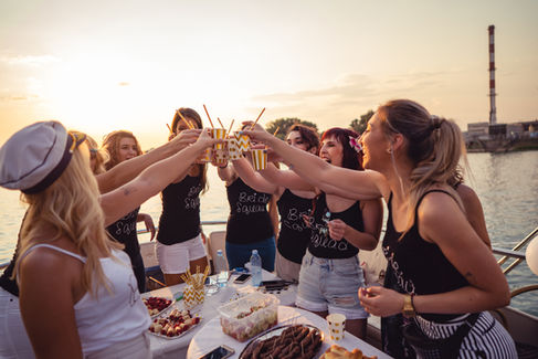 Friends enjoying dinner with a beautiful sunset