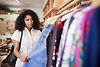 Woman Browsing in Clothing Store