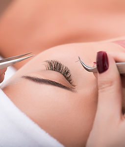 Applying false lashes in a salon