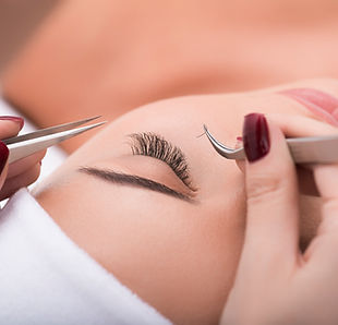 Applying false lashes in a salon
