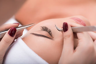 Applying false lashes in a salon