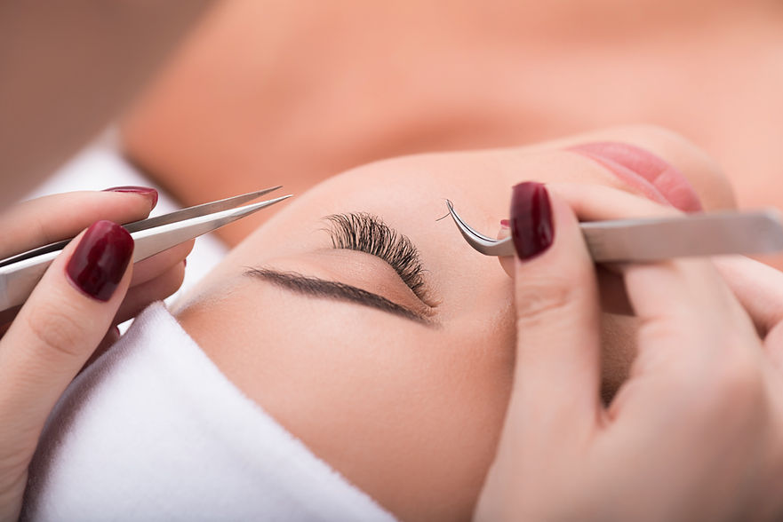 Applying false lashes in a salon