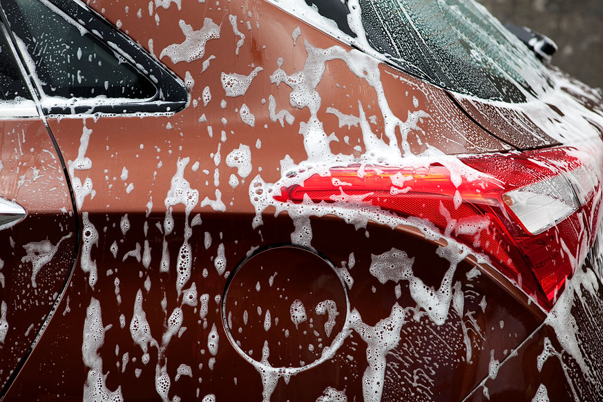 Close-up of a red car during car valeting