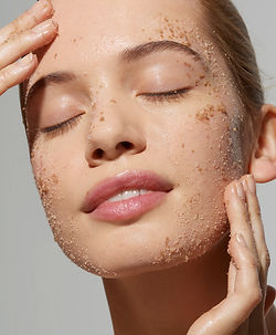 Woman Exfoliating Face