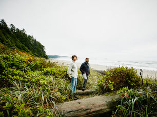 Couple relaxing calmly together while a stormy ocean fades behind them, symbolizing intense versus stable relationship dynamics.