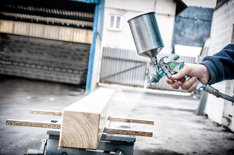 spraying wood with spray gun