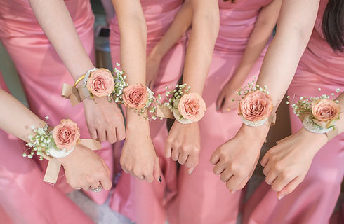 A group of women wearing floral corsages