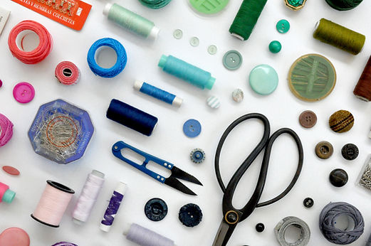 Sewing tools and accessories such as scissors, thread, pins and snips