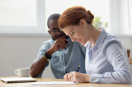 Medicare Counselor with patient signing contract.