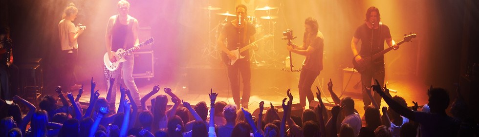 Live band performing on stage during the Tastes & Tunes festival in Santa Barbara.