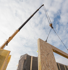 Crane Installing Structural Panels