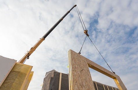 Crane Installing Structural Panels