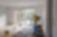 Room under renovation with wood flooring, large window, and tools around