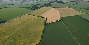 Aerial View of Green Energy Generator Wind Turbines Farms, Solar Panels at Village of Engl