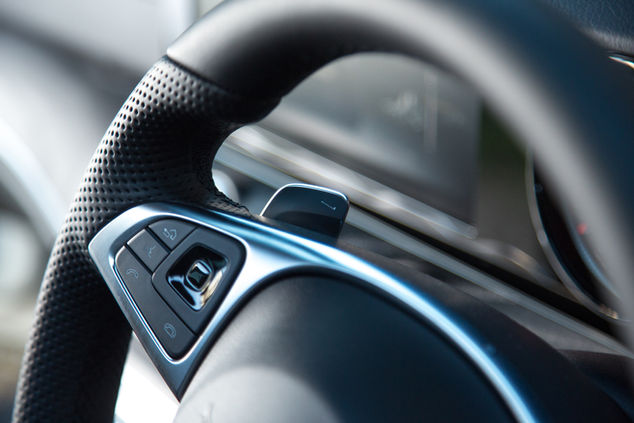 Close-up of a modern car's steering wheel.