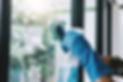 housekeeping and cleaning concept, Happy young man wiping dust using a spray