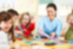 Nursery teacher playing with the kids