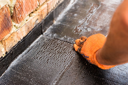 Roofer presses, just weld layers of roofing material. Flat roof installation. Heating and